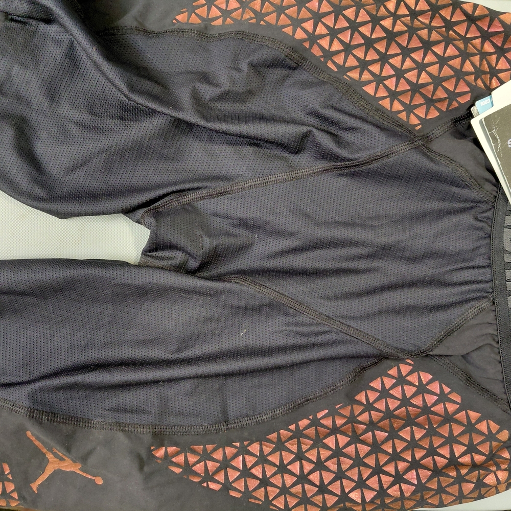 Nike Men's Black Athletic Shorts with Orange Accents